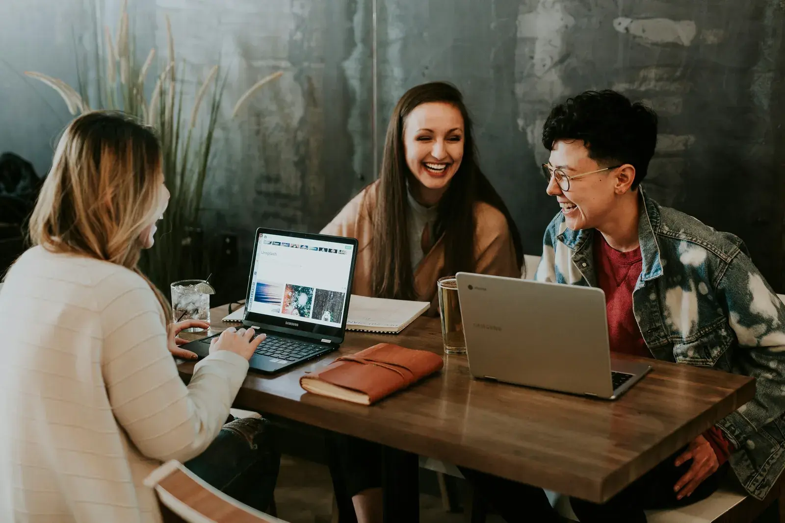 People collaborating at a computer